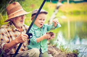 Grandfather and grandson fishing
